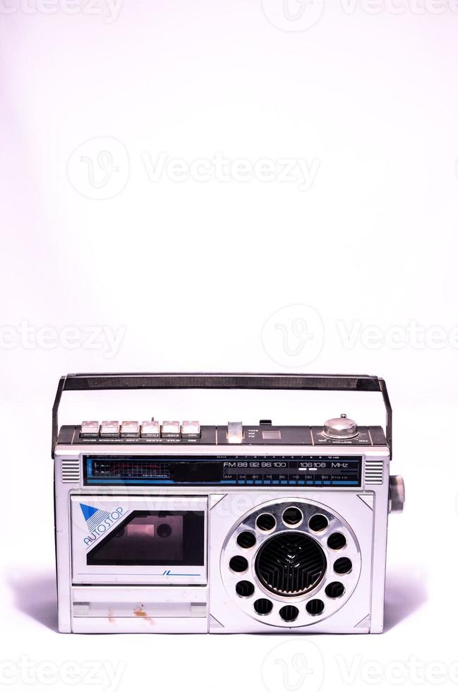 Old casette player and radio on white background photo