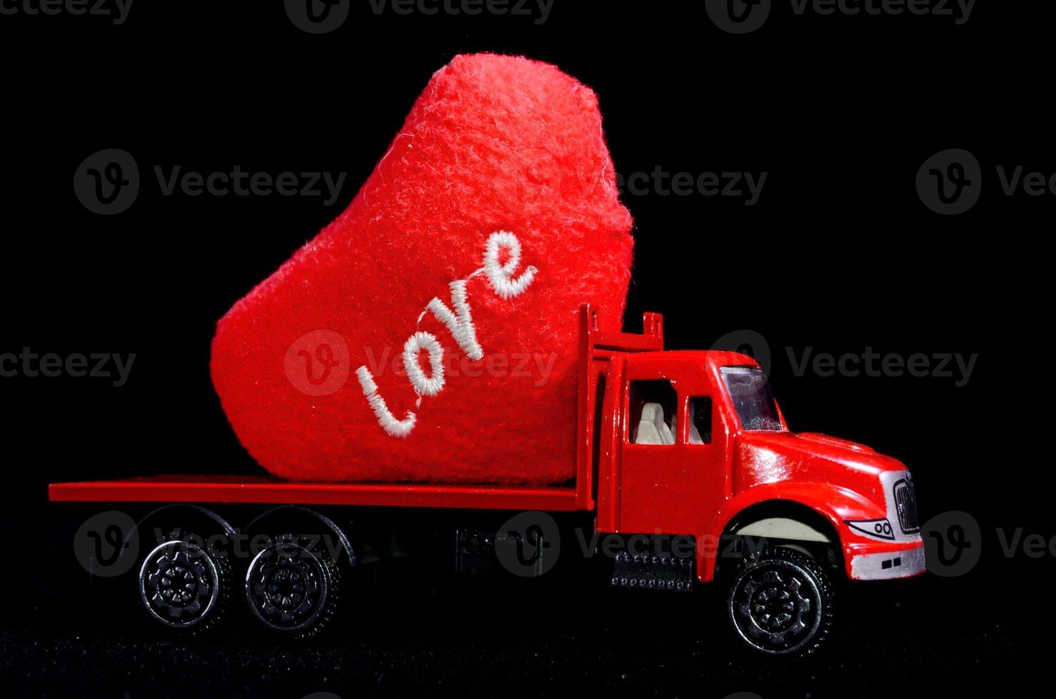 Red heart on a toy truck photo