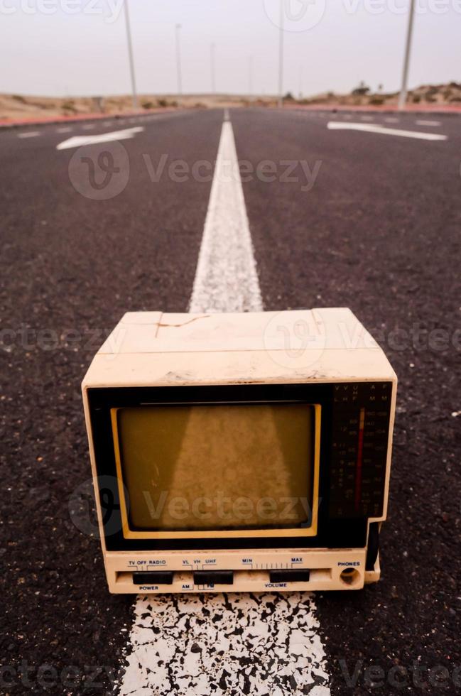 Old television on the road photo