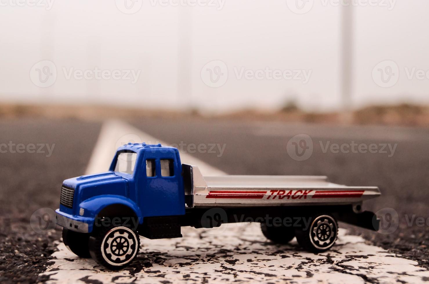 Toy truck on the road photo