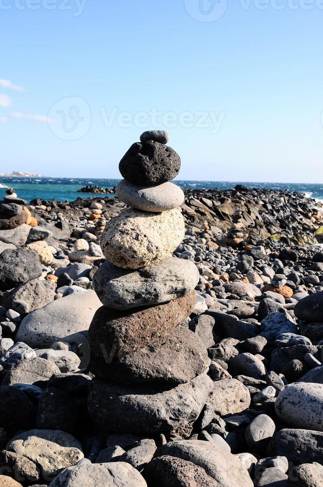 Stacked rocks on the beach photo
