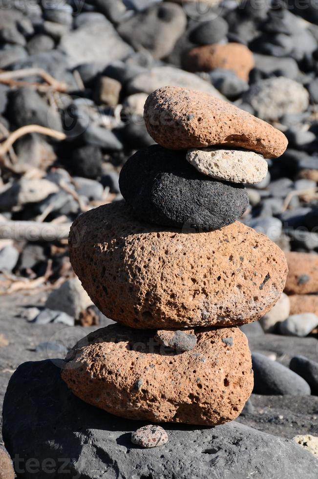 Stacked rocks on the beach photo