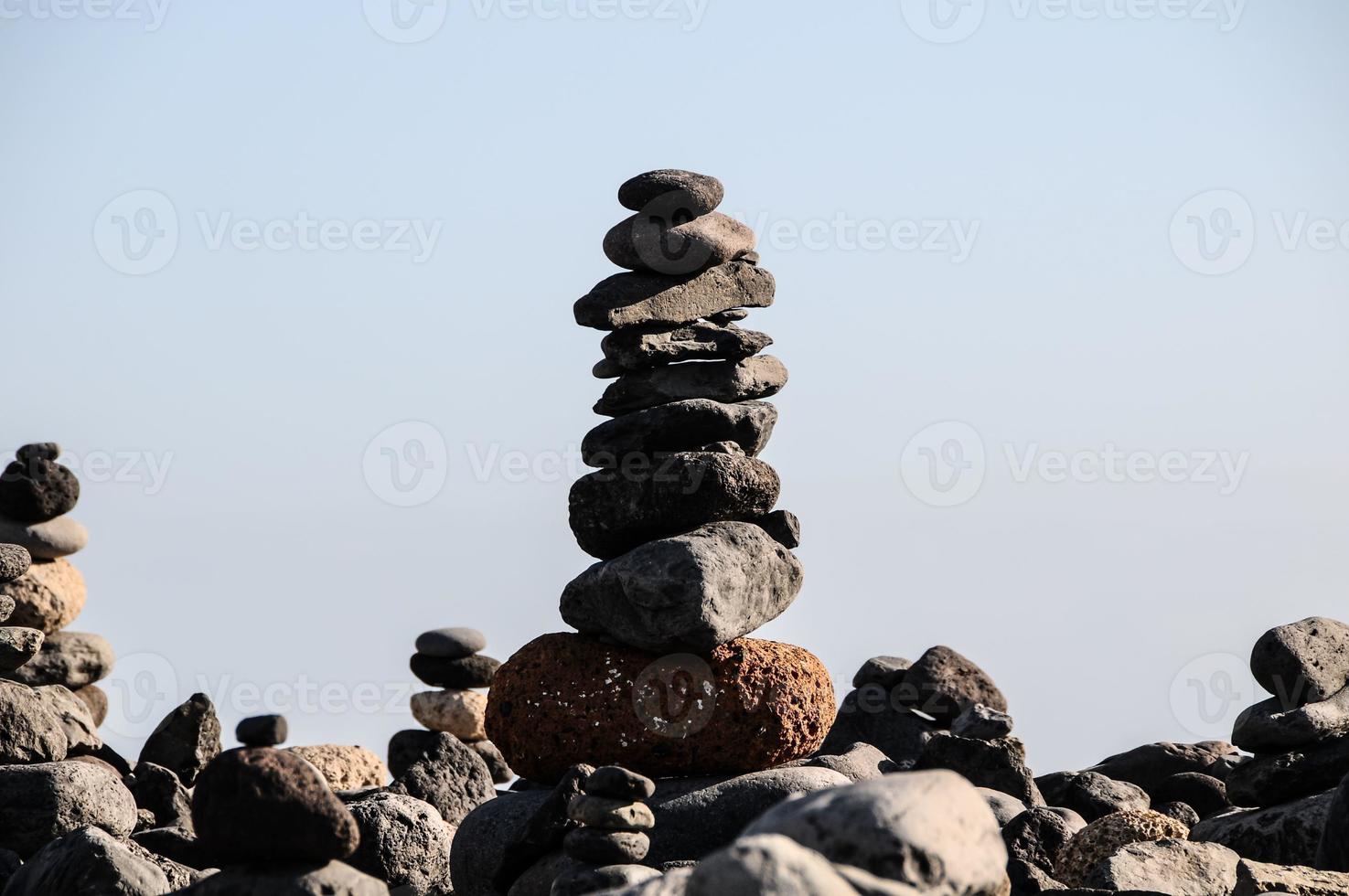 Stacked rocks on the beach photo