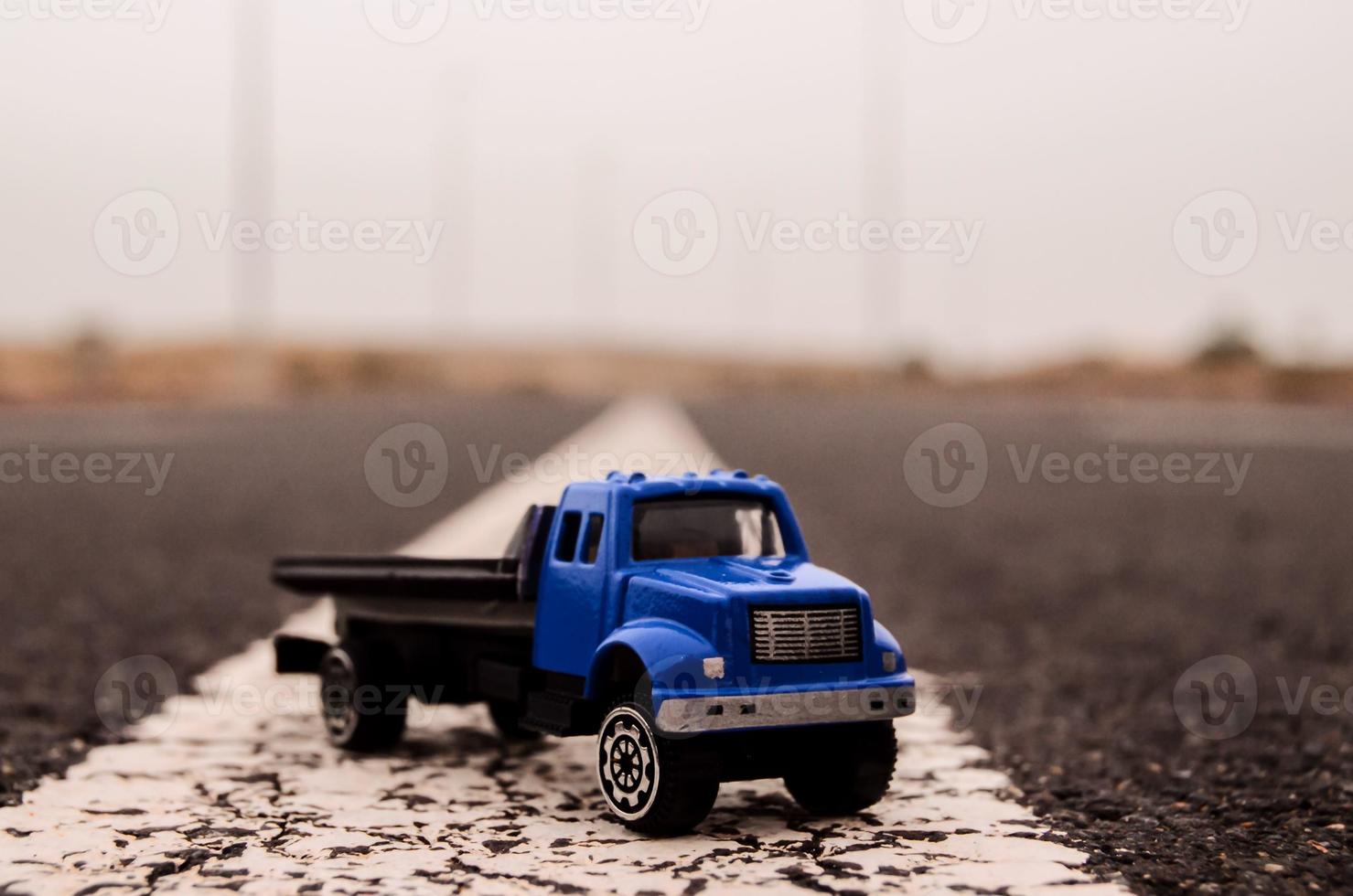 Toy truck on the road photo