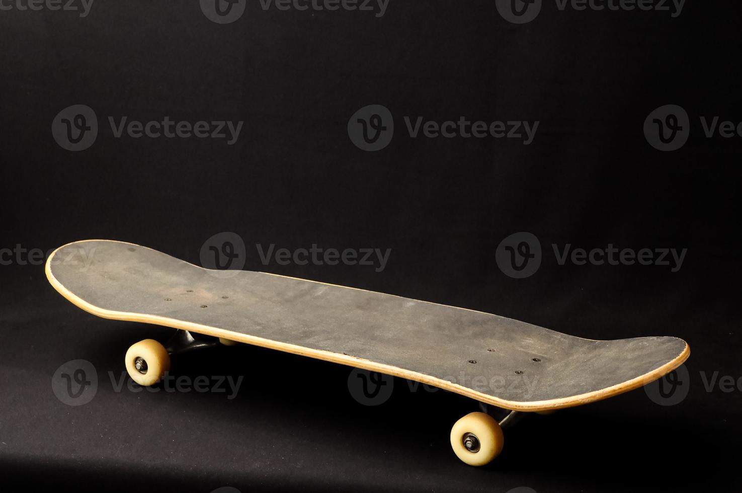 Skateboard on black background photo