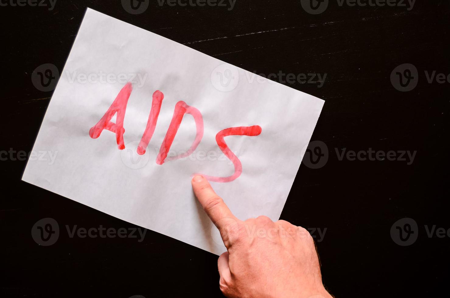 AIDS written on paper photo