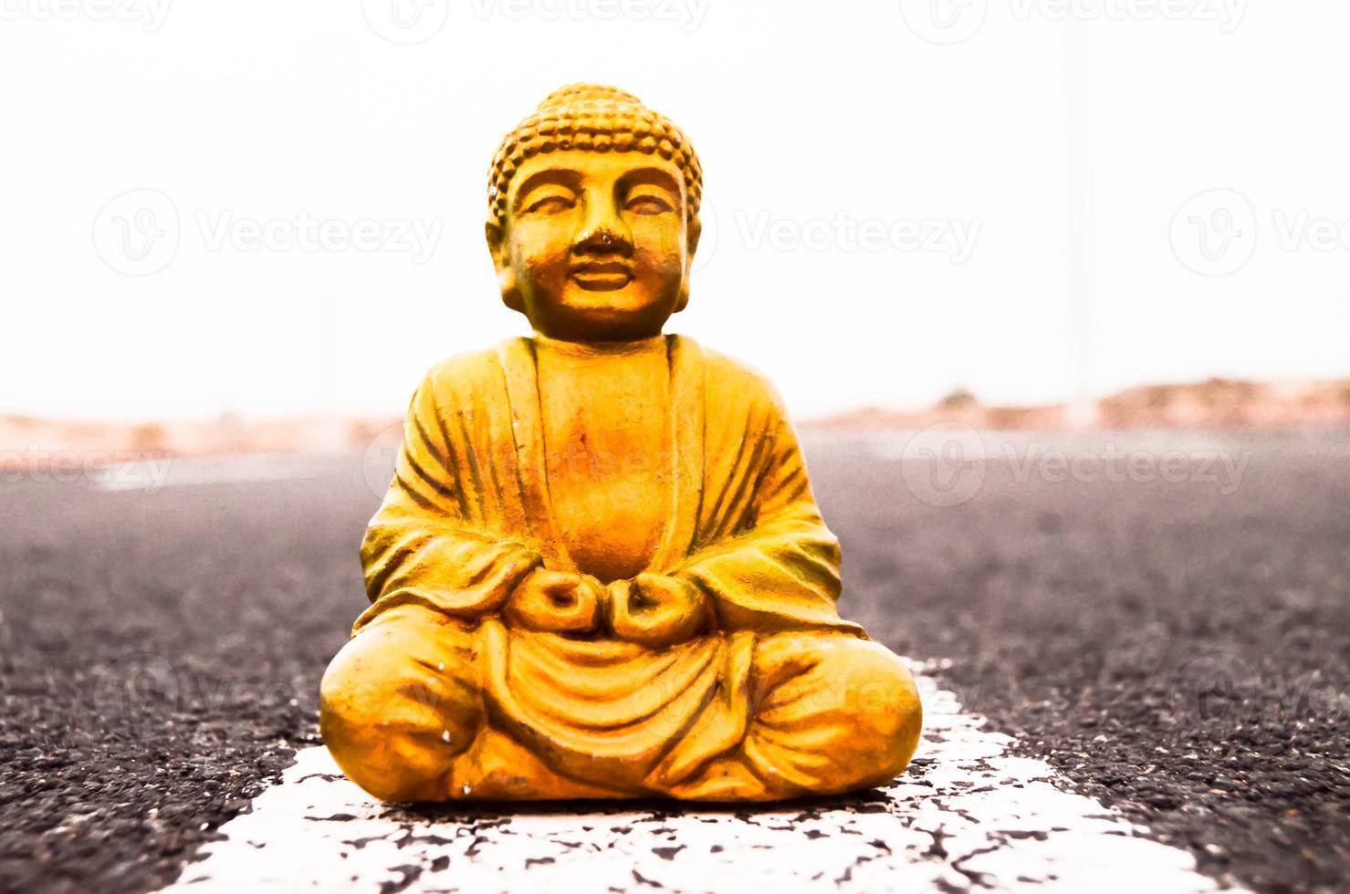 Buddha statue tape on the road photo