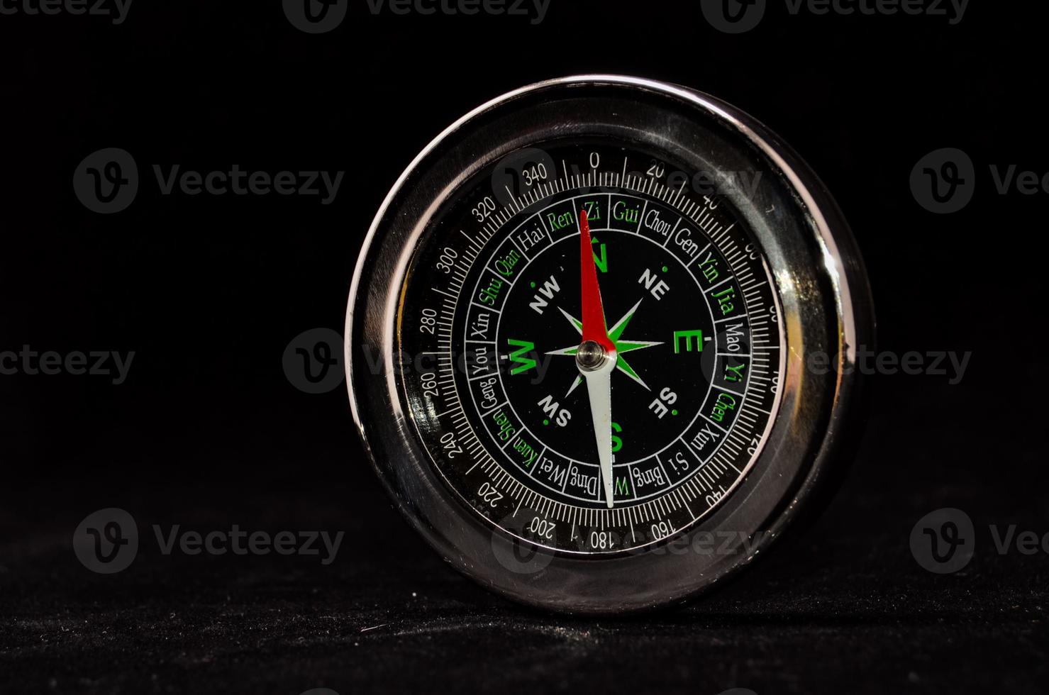 Compass on black background photo