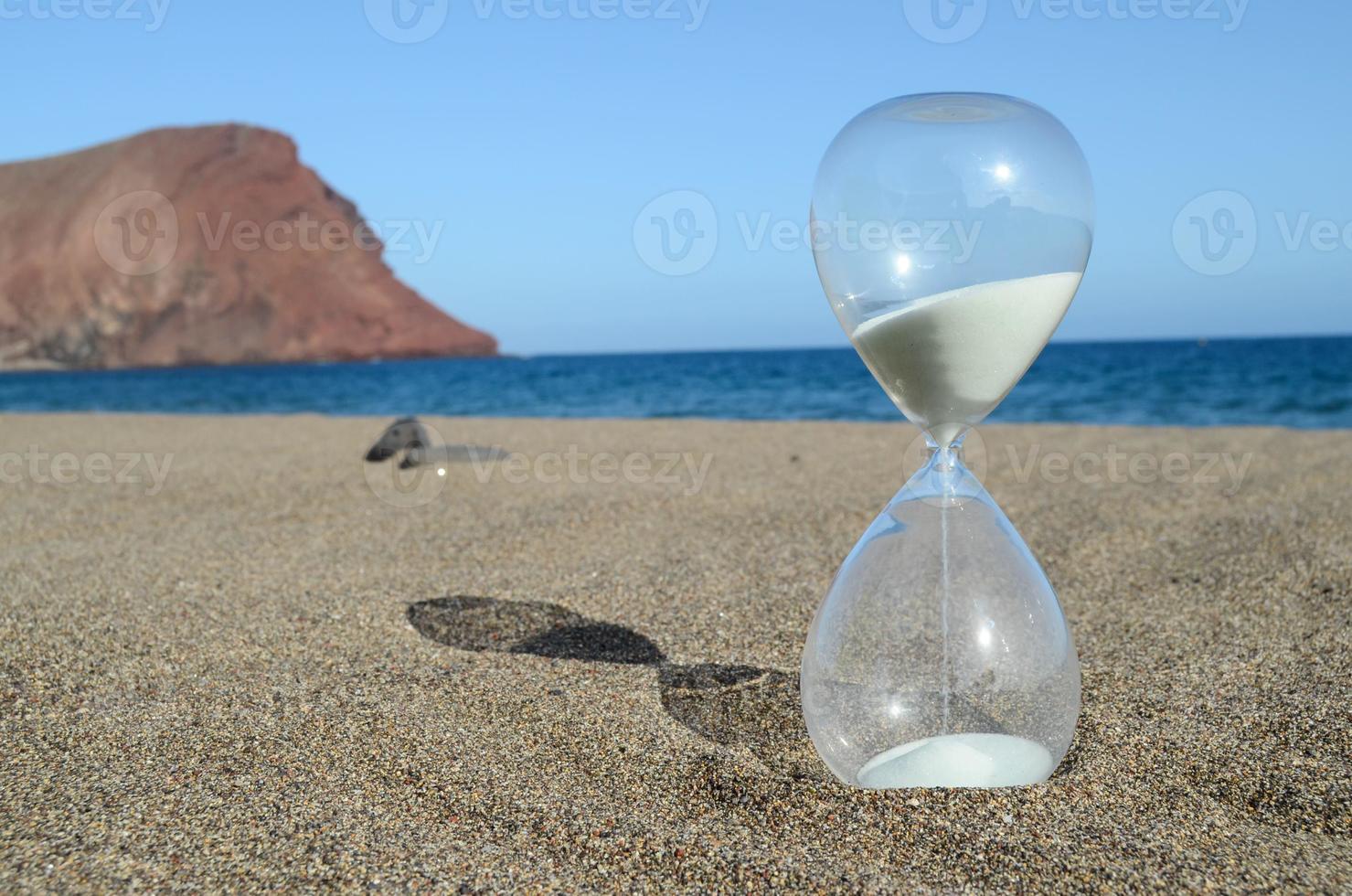 Hourglass on the beach photo