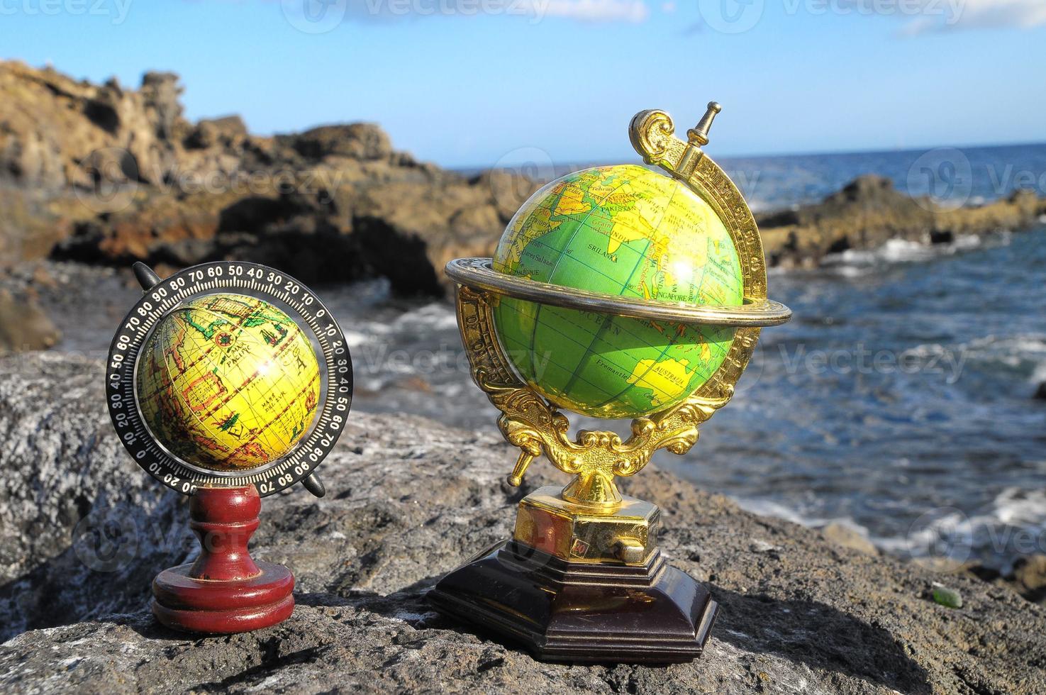 Globes on a rock photo