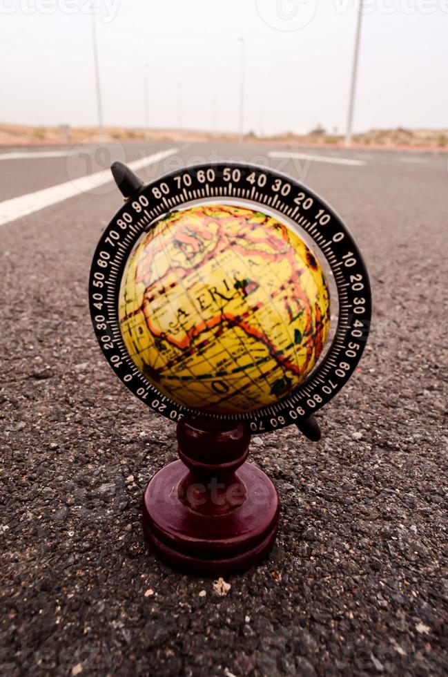 Globe on the road photo