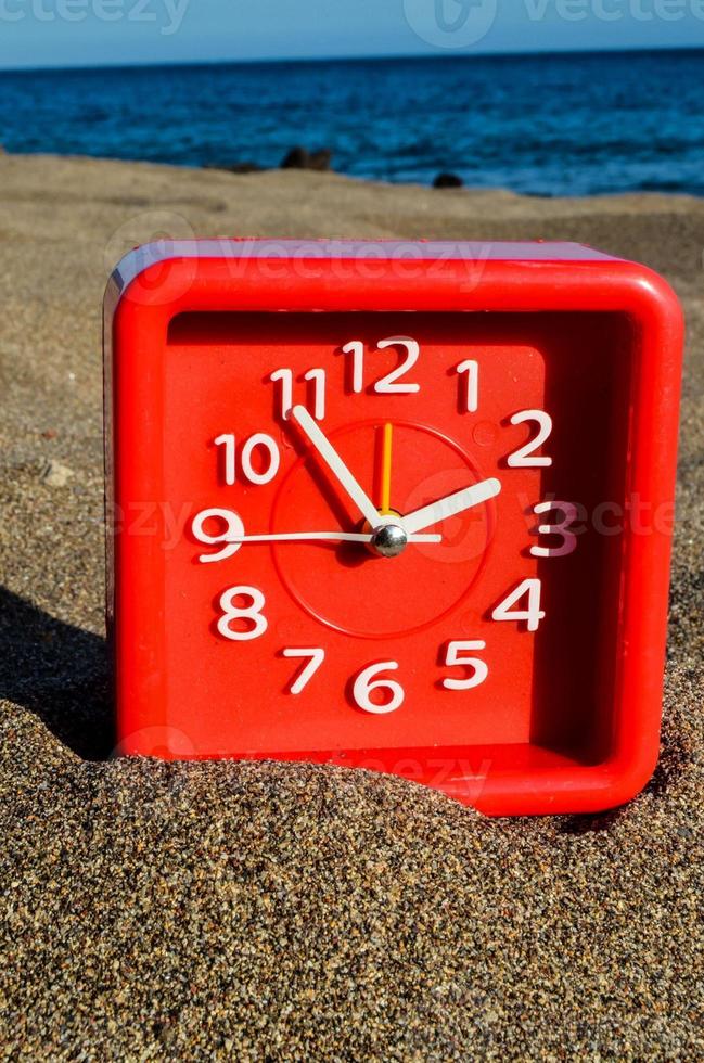 Clock on the beach photo