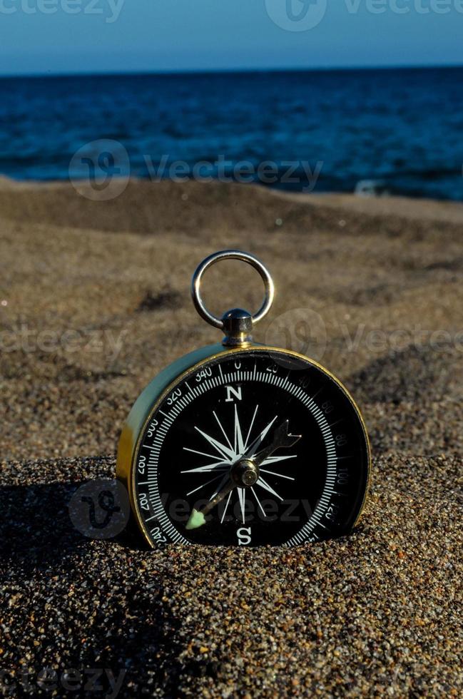 Compass in the sand photo