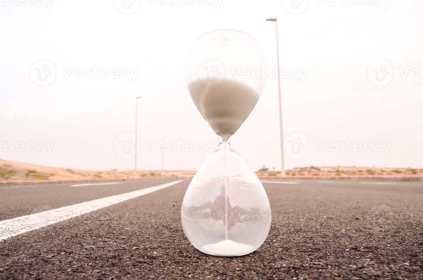 Hourglass on the road photo