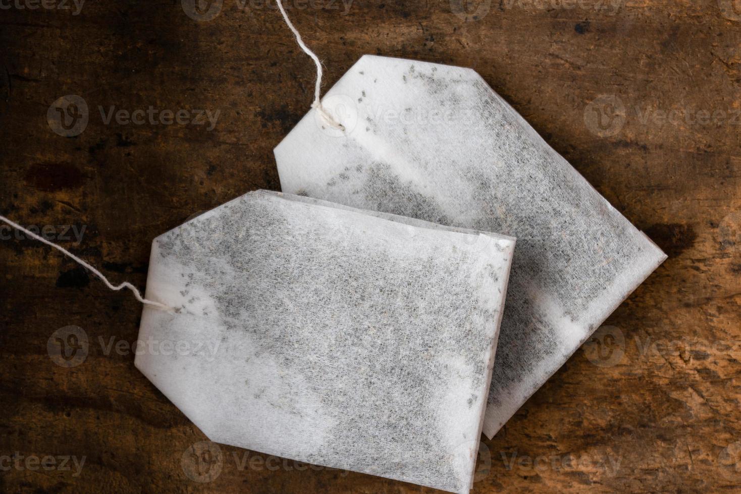 Tea Bags on Wood Background photo
