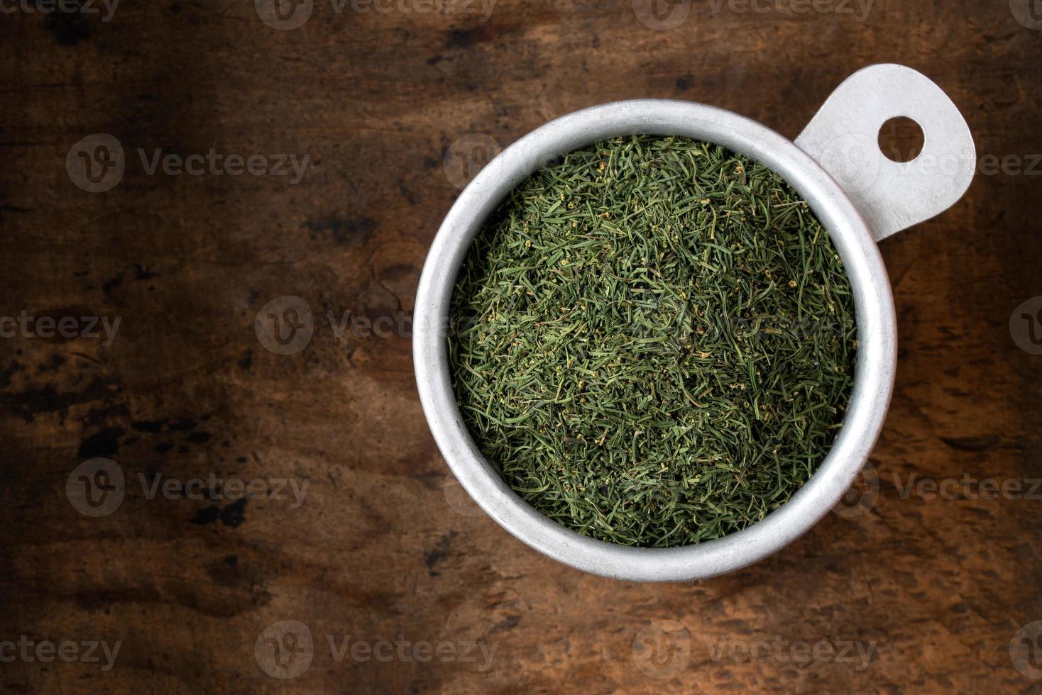 Dill Weed in a Measuring Cup photo