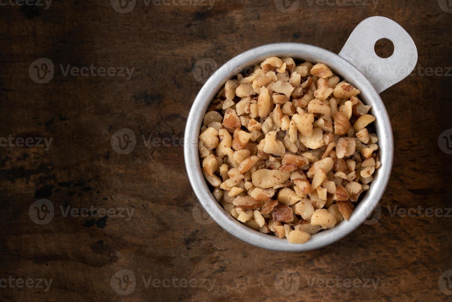 Chopped Walnuts in a Measuring Cup 18883006 Stock Photo at Vecteezy