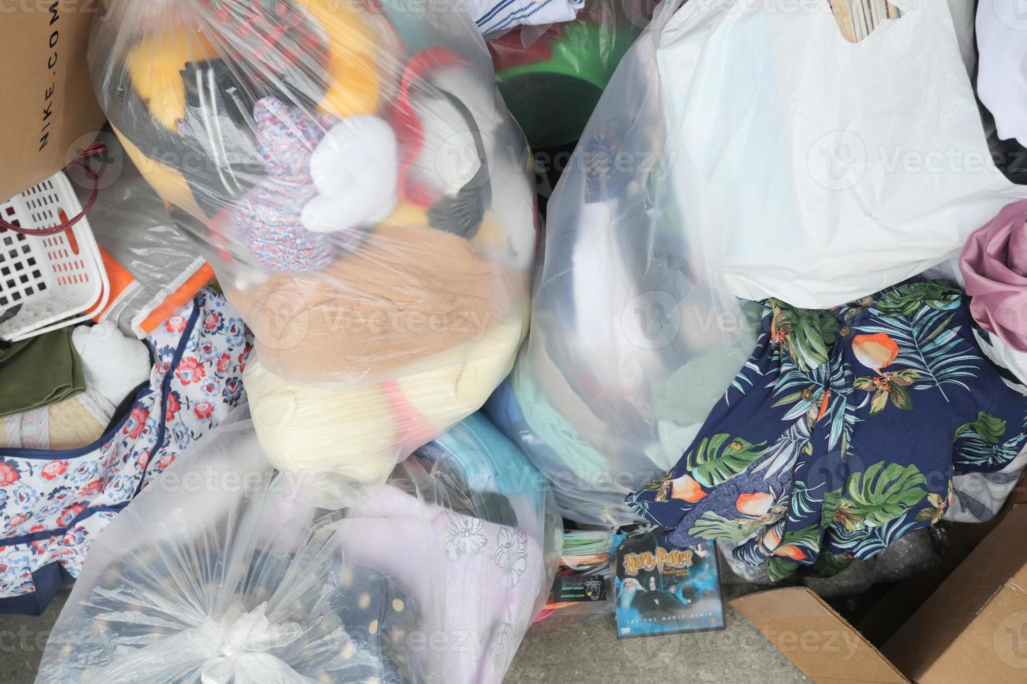 dumped donated items in a large container outdoor photo