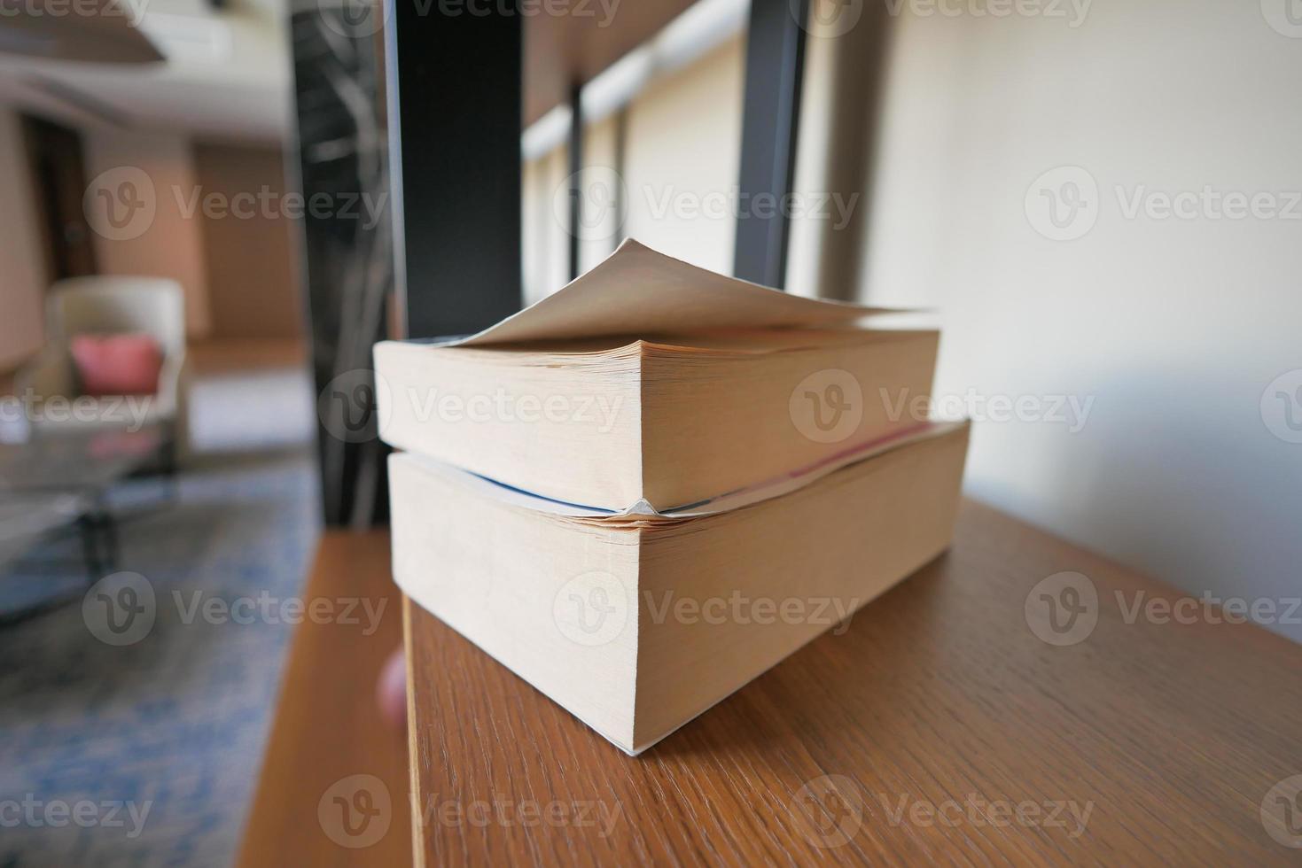 stack of books in a shelf photo