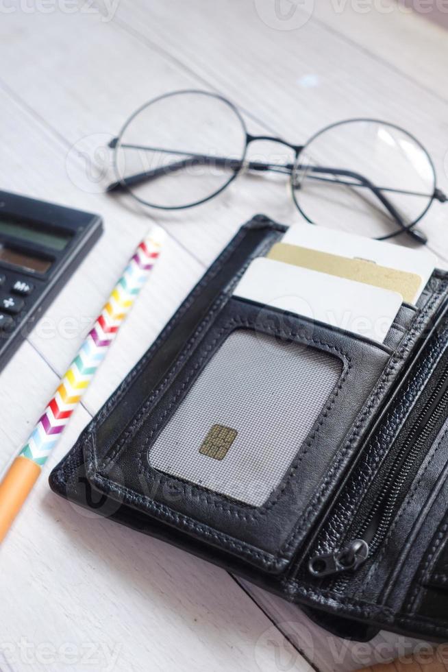 close up of credit cards in a wallet on wooden background photo