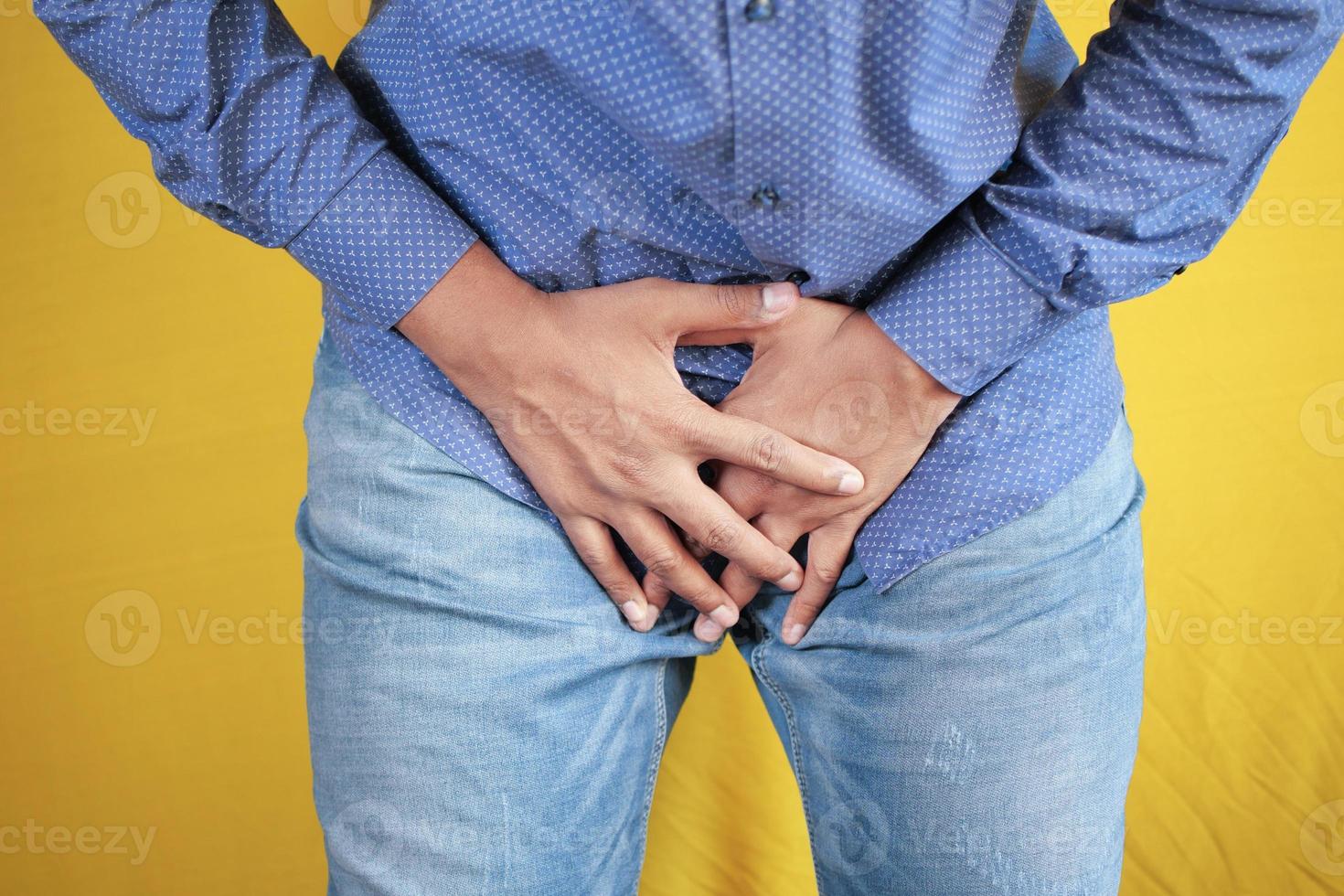 the concept of prostate and bladder problem, crotch pain of a young person photo