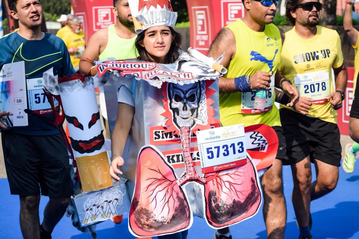 New Delhi, India - October 16 2022 - Vedanta Delhi Half Marathon race after covid in which marathon participants about to cross the finish line, Delhi Half Marathon 2022 photo