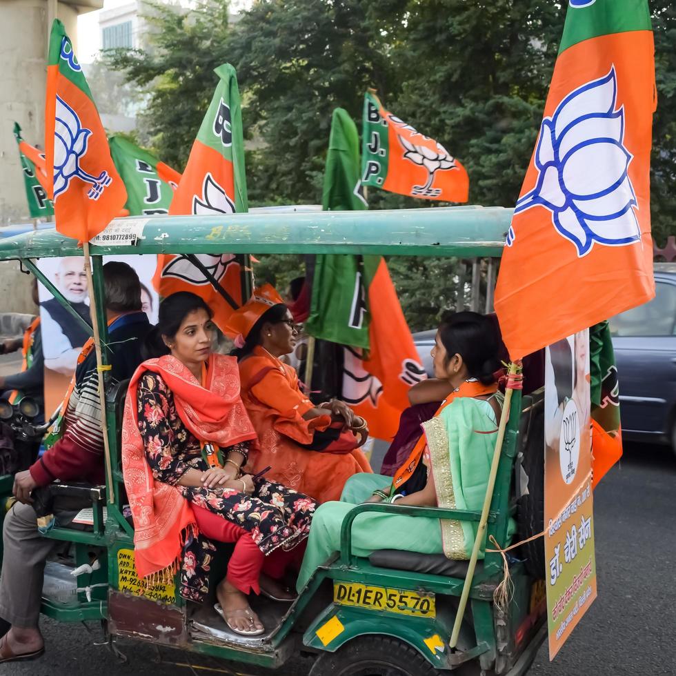 Delhi, India, December 02 2022 -Bharatiya Janata Party BJP supporter during mega road show in support of BJP candidate Pankaj Luthara to file nomination papers ahead of MCD local body Elections 2022 photo