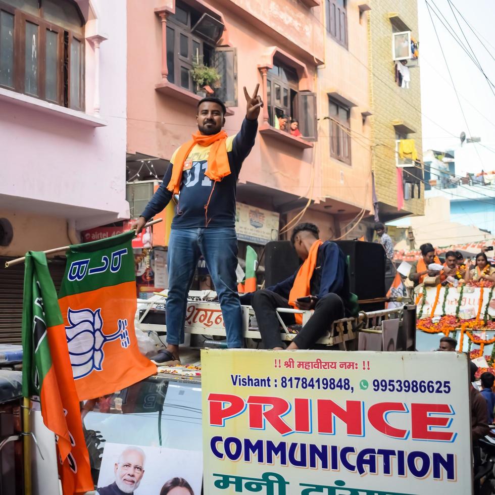 Delhi, India, December 02 2022 -Bharatiya Janata Party BJP supporter during mega road show in support of BJP candidate Pankaj Luthara to file nomination papers ahead of MCD local body Elections 2022 photo