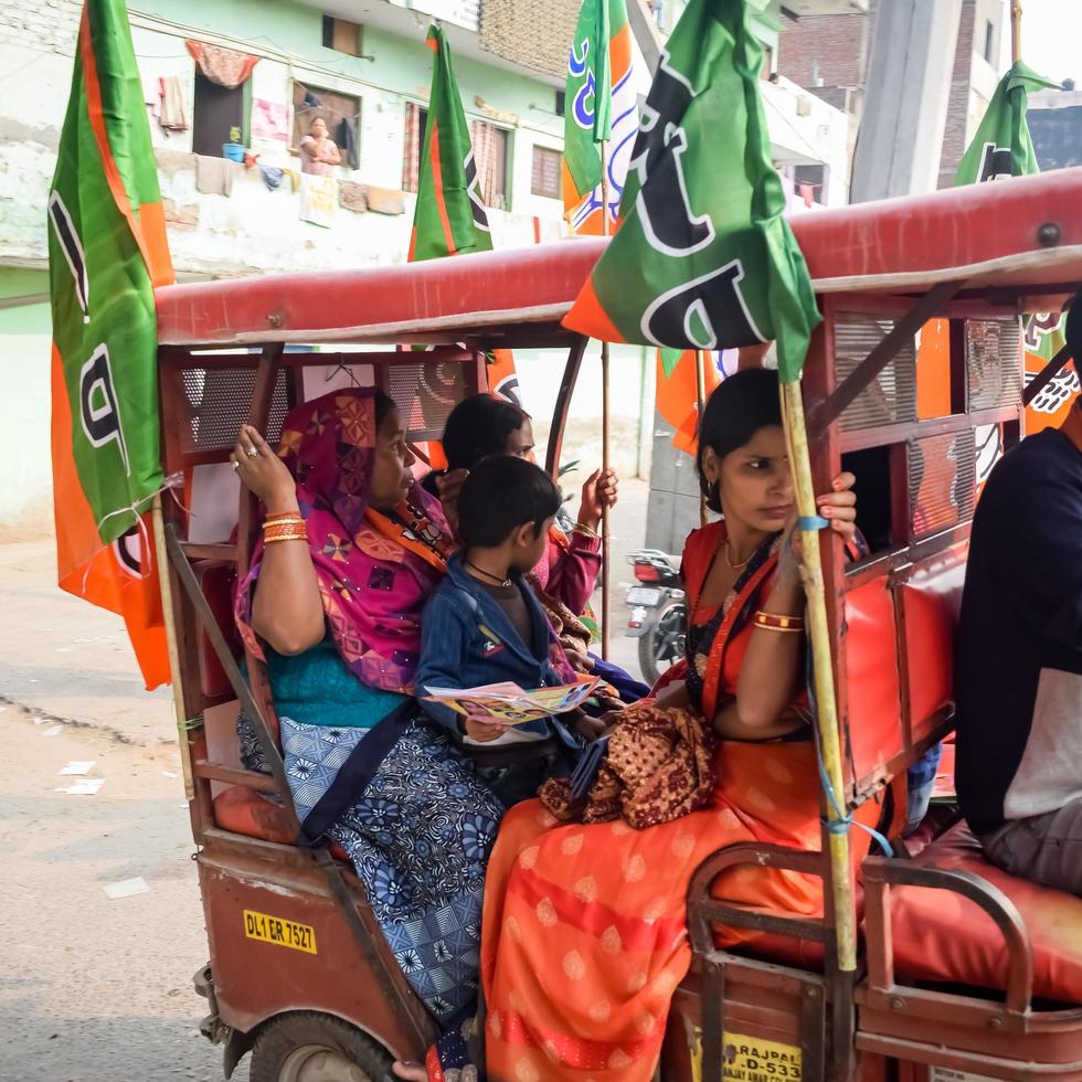 Delhi, India, December 02 2022 -Bharatiya Janata Party BJP supporter during mega road show in support of BJP candidate Pankaj Luthara to file nomination papers ahead of MCD local body Elections 2022 photo