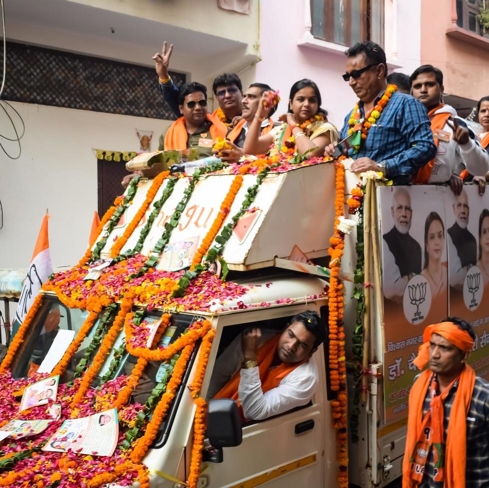 Delhi, India, December 02 2022 -Bharatiya Janata Party BJP supporter during mega road show in support of BJP candidate Pankaj Luthara to file nomination papers ahead of MCD local body Elections 2022 photo