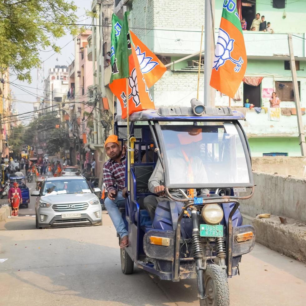 Delhi, India, December 02 2022 -Bharatiya Janata Party BJP supporter during mega road show in support of BJP candidate Pankaj Luthara to file nomination papers ahead of MCD local body Elections 2022 photo