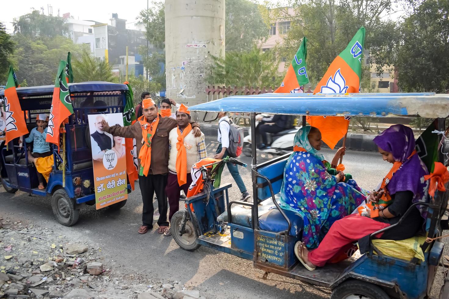 Delhi, India, December 02 2022 -Bharatiya Janata Party BJP supporter during mega road show in support of BJP candidate Pankaj Luthara to file nomination papers ahead of MCD local body Elections 2022 photo