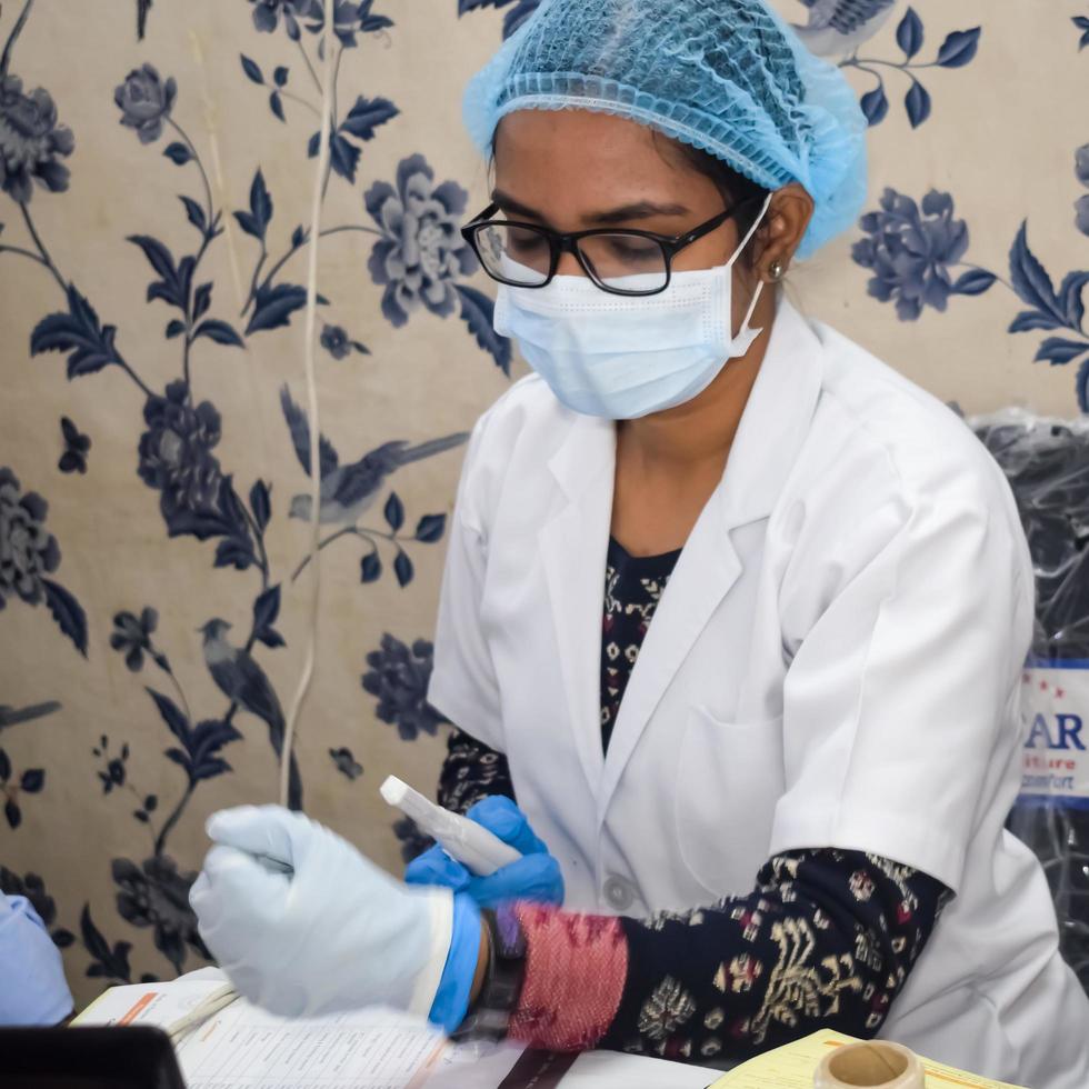 Delhi, India - November 19, 2022 - Basic routine health check-up camp has been organized by max hospital specialized doctors, Patient at annual health check-up, Doctor doing health check-up to patient photo