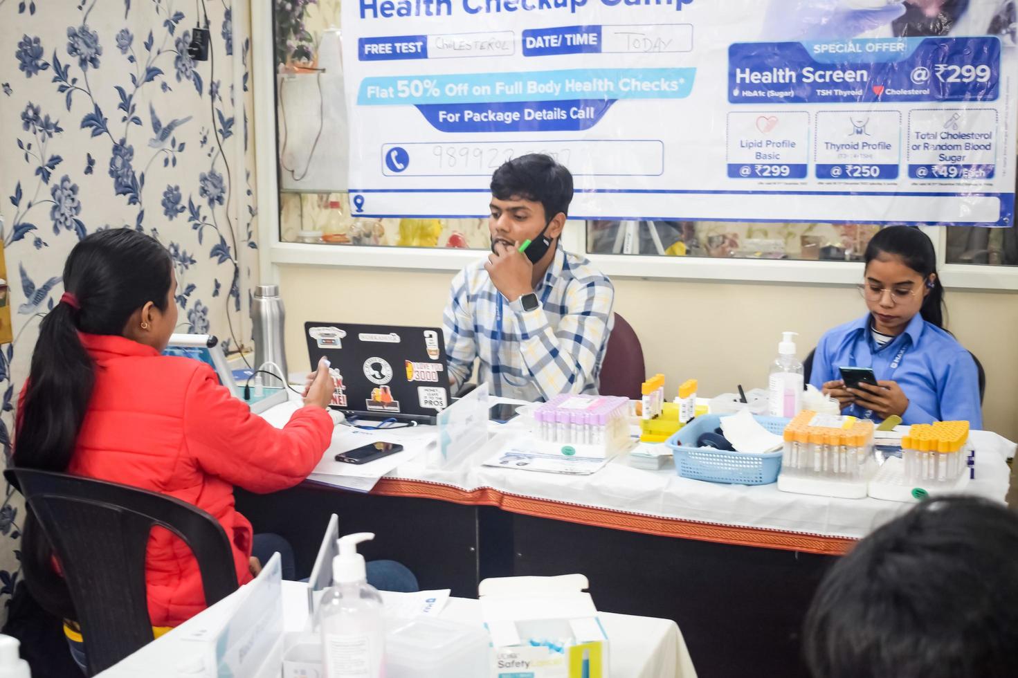 Delhi, India - November 19, 2022 - Basic routine health check-up camp has been organized by max hospital specialized doctors, Patient at annual health check-up, Doctor doing health check-up to patient photo
