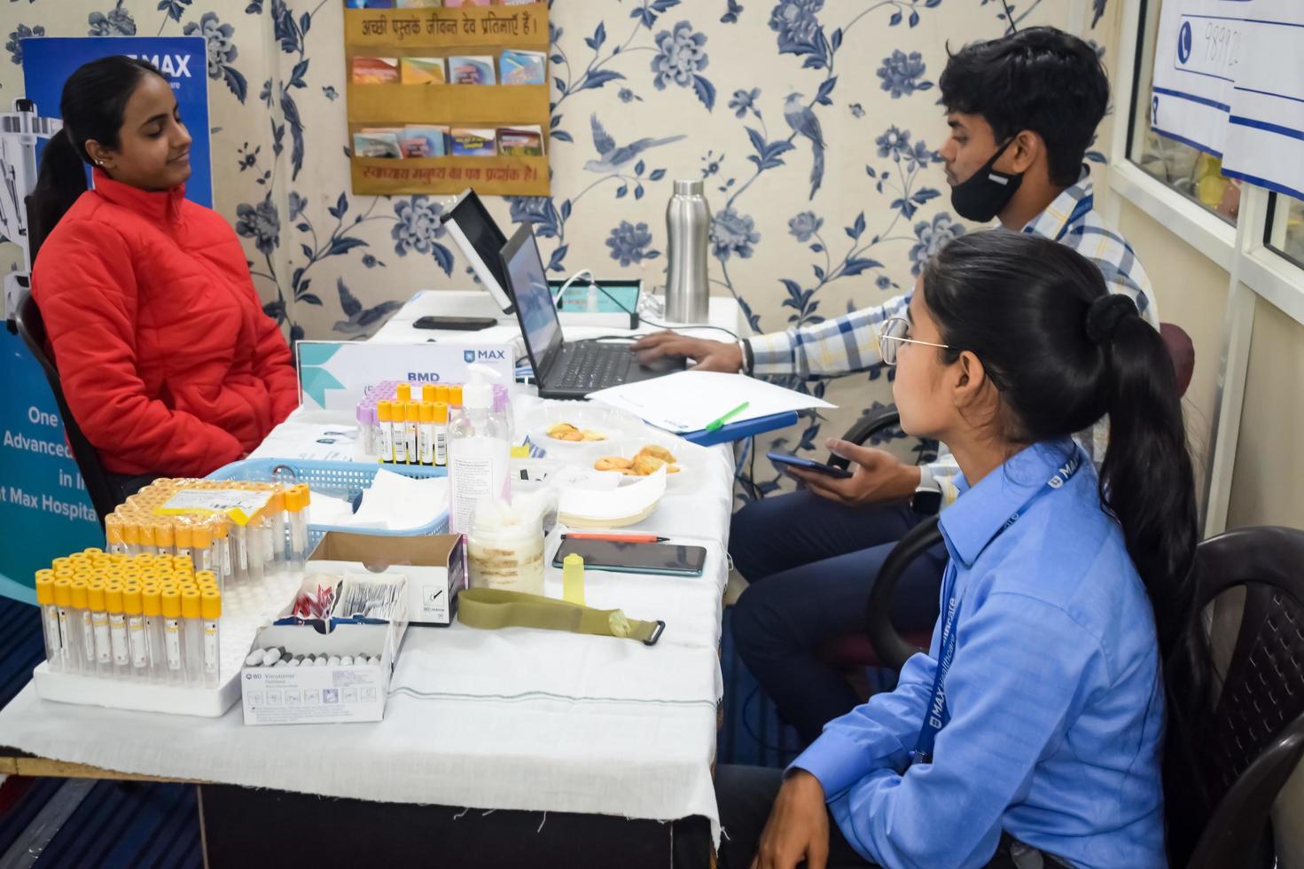 Delhi, India - November 19, 2022 - Basic routine health check-up camp has been organized by max hospital specialized doctors, Patient at annual health check-up, Doctor doing health check-up to patient photo