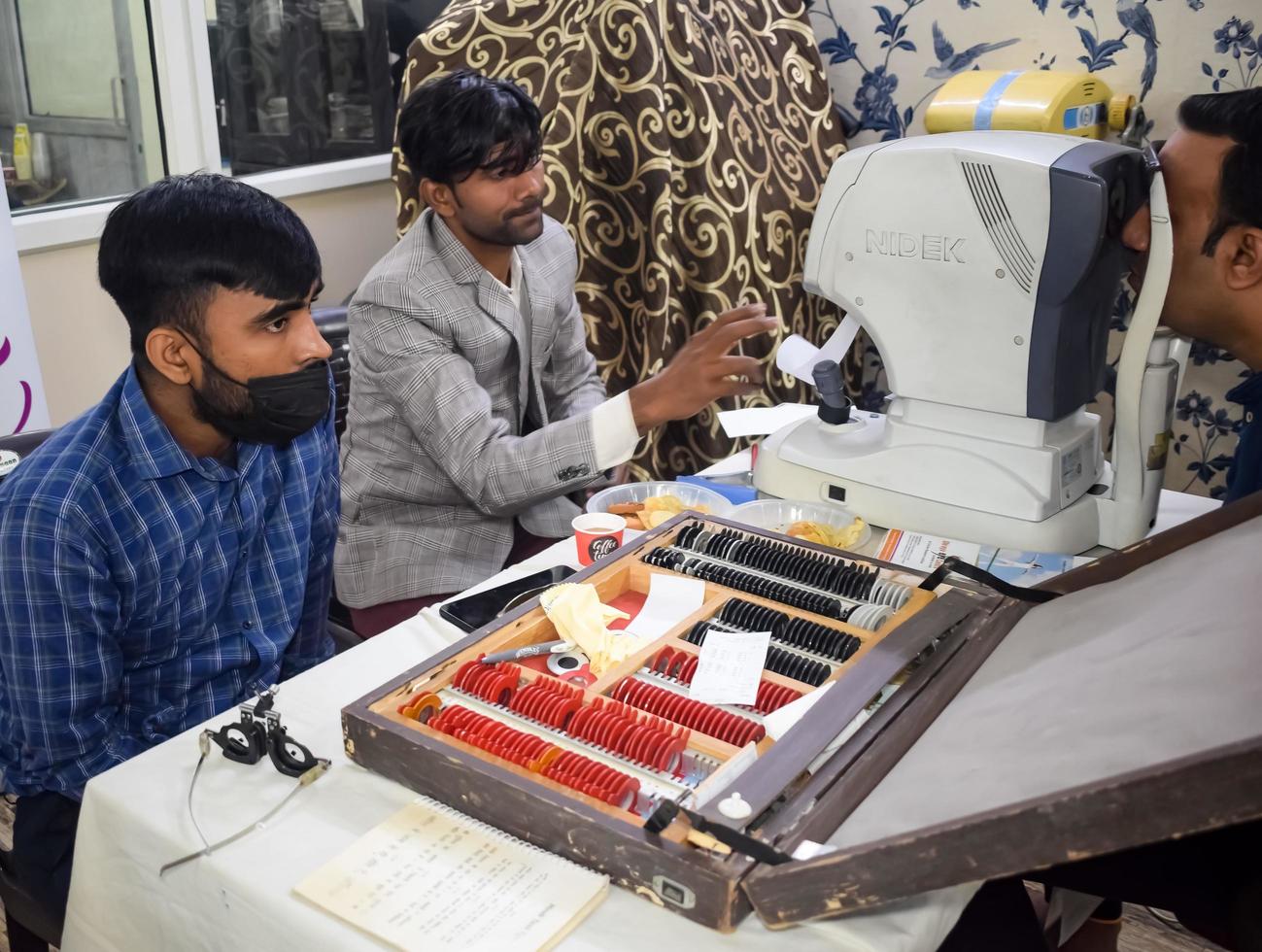 Delhi, India - November 19, 2022 - Basic routine health check-up camp has been organized by max hospital specialized doctors, Patient at annual health check-up, Doctor doing health check-up to patient photo