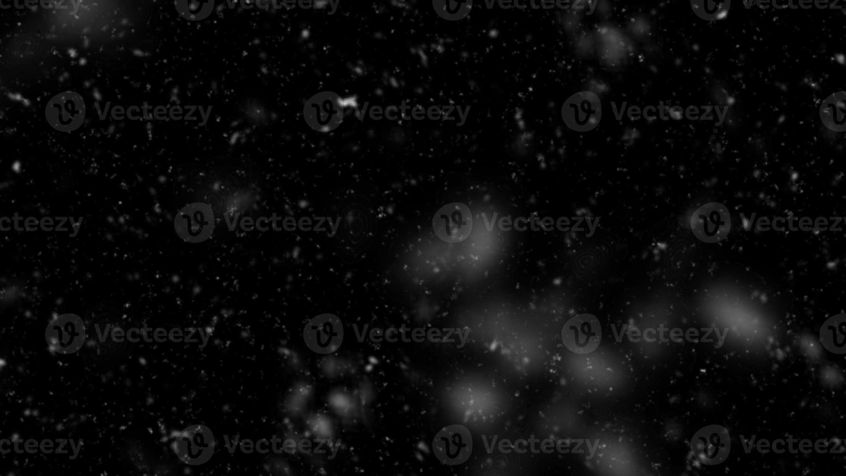 Snowfall bokeh on black background. Many snowflakes in flying in the air. Winte night snowfall and blizzard of snow at. Blur bokeh light effect creative background. photo