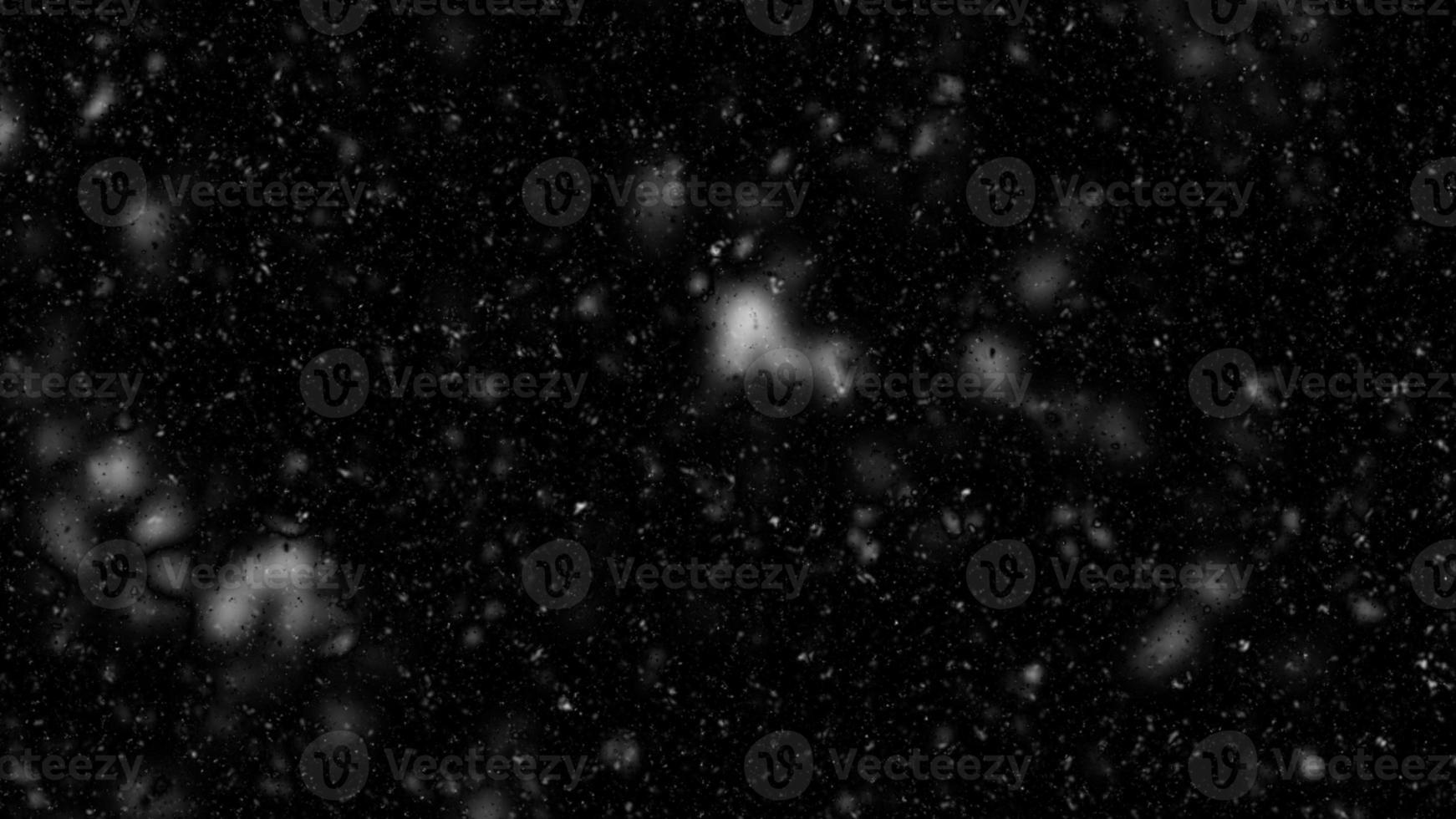 Different realistic falling snow or snowflakes. Falling snow isolated on black background. Winter snowfall illustration. Bokeh lights on black background, flying snowflakes in the air. Snow at night. photo