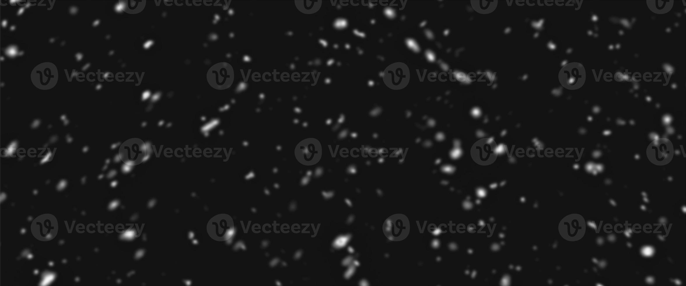Different realistic falling snow or snowflakes. Falling snow isolated on black background. Winter snowfall illustration. Bokeh lights on black background, flying snowflakes in the air. Snow at night. photo