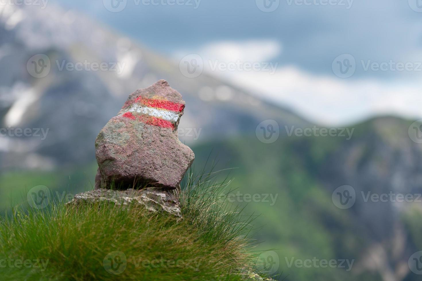Colorful trail sign of a mountain trail photo