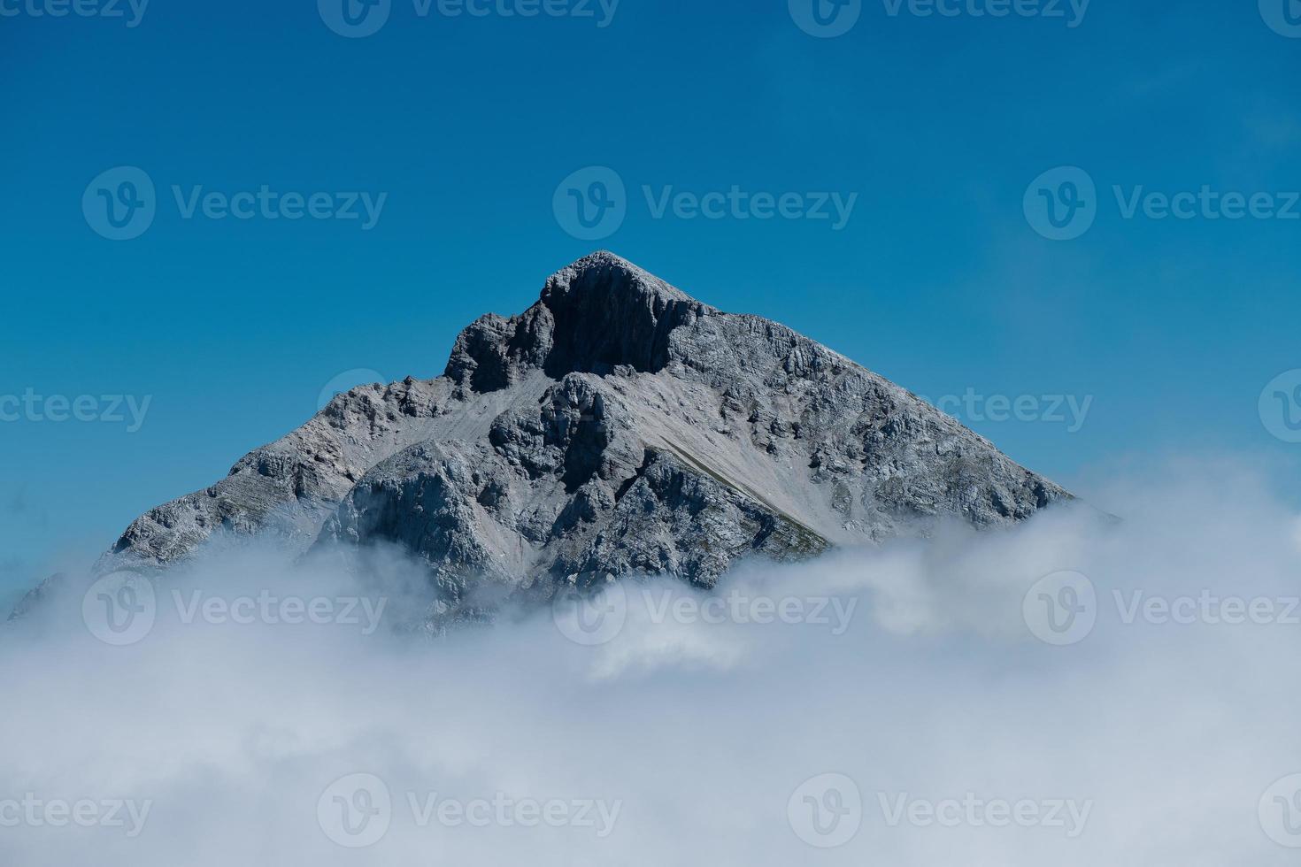 Mount Arera in the pre-Alps of Bergamo above the clouds photo
