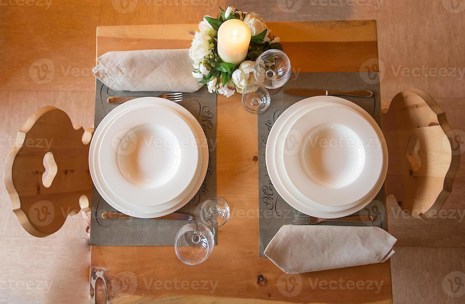 Table set in mountain chalet for two people photo