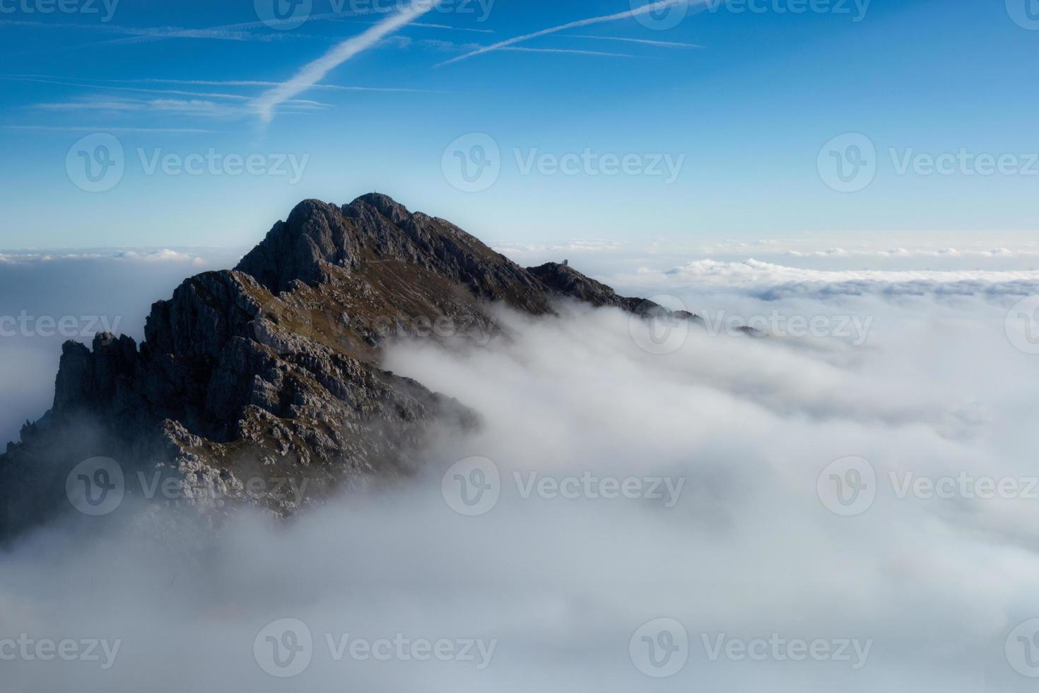 Mount Alben on the Orbie Alps above a sea of clouds photo