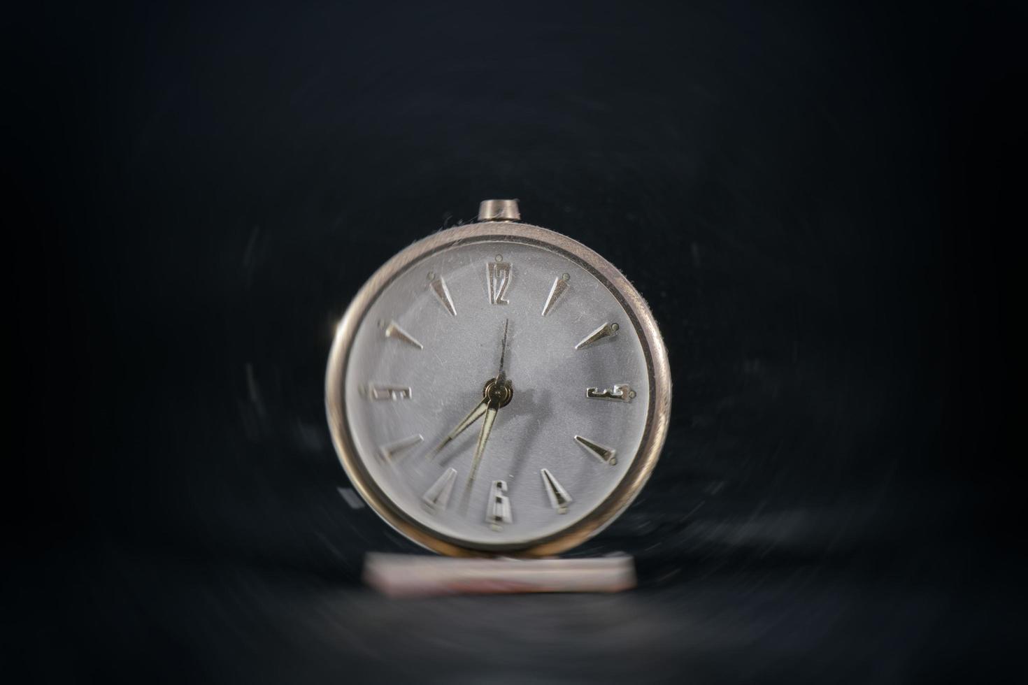 Antique vintage table clock. With blur effect photo
