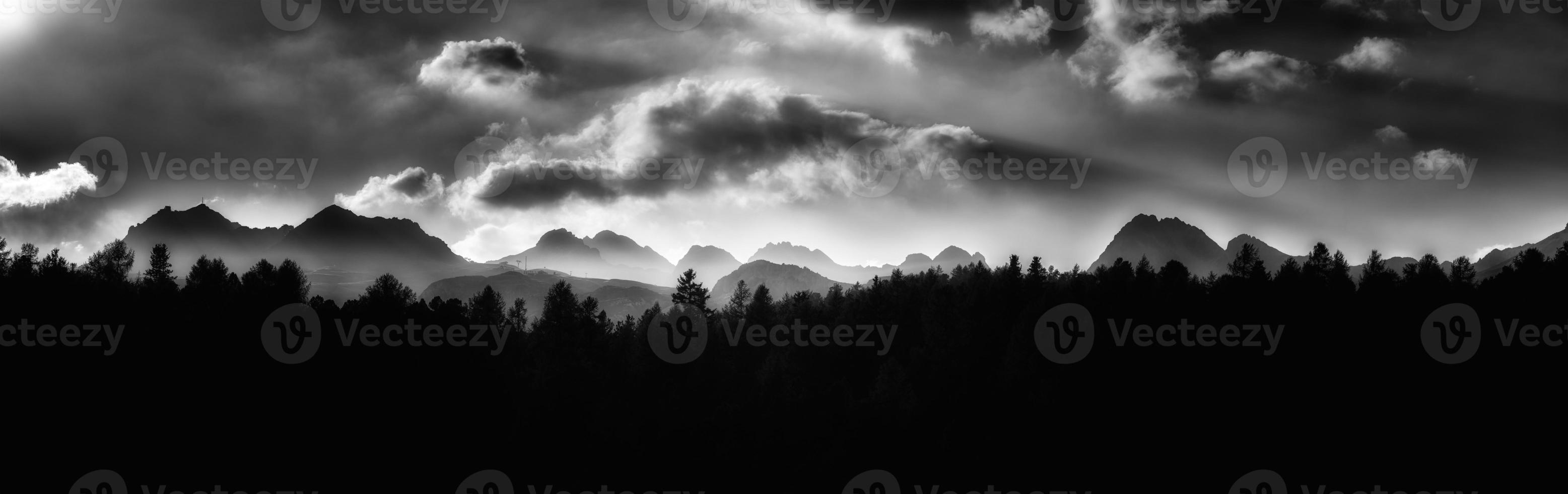 Panorama of profile of mountains in black and white photo