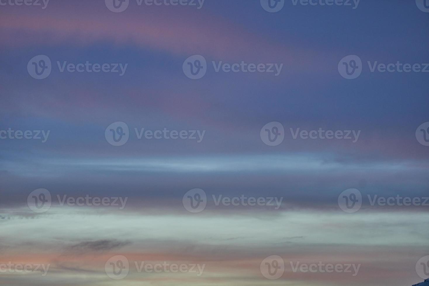 Striped blue red blue sky in the mountains photo