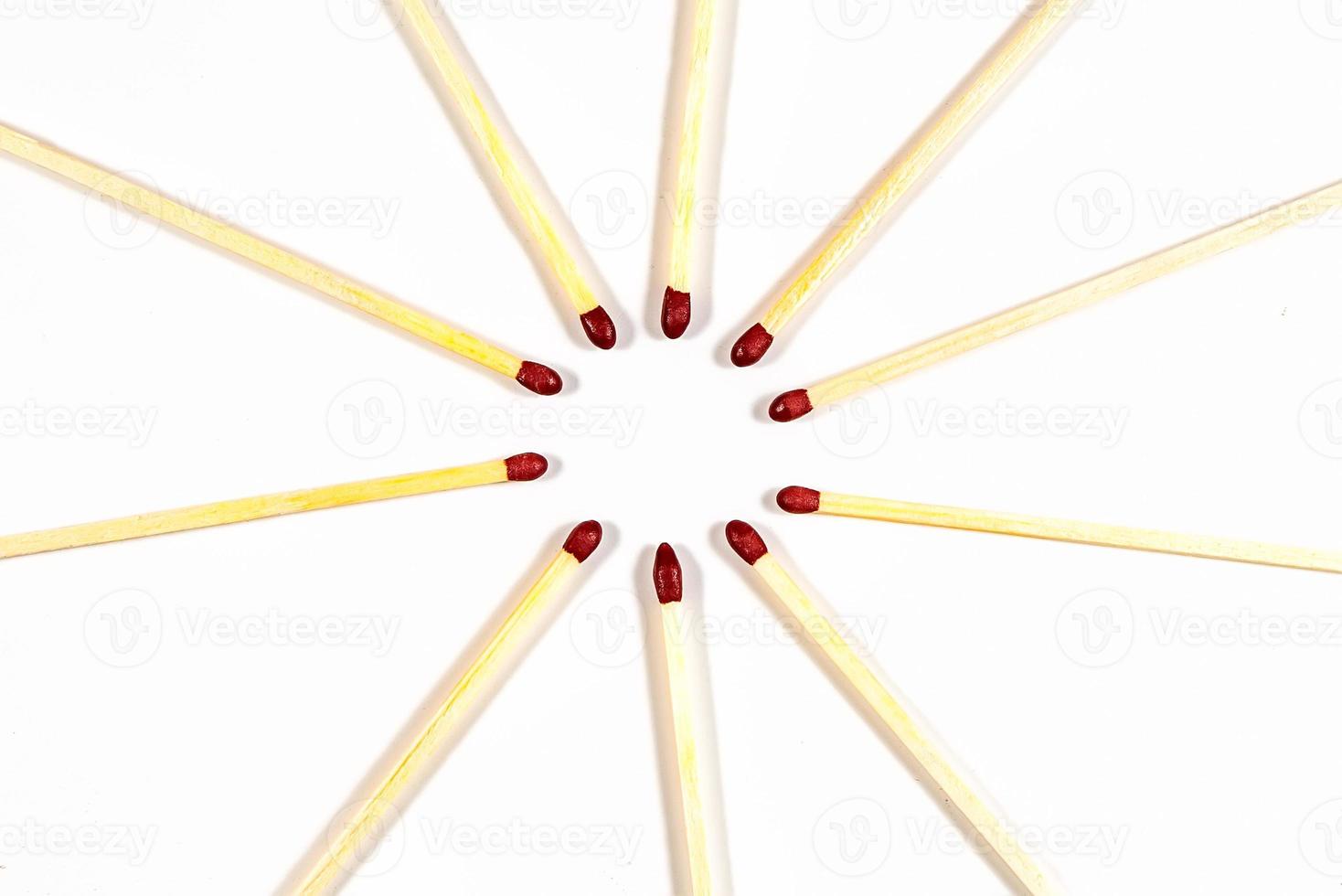 Some matches in a circle on a white background photo