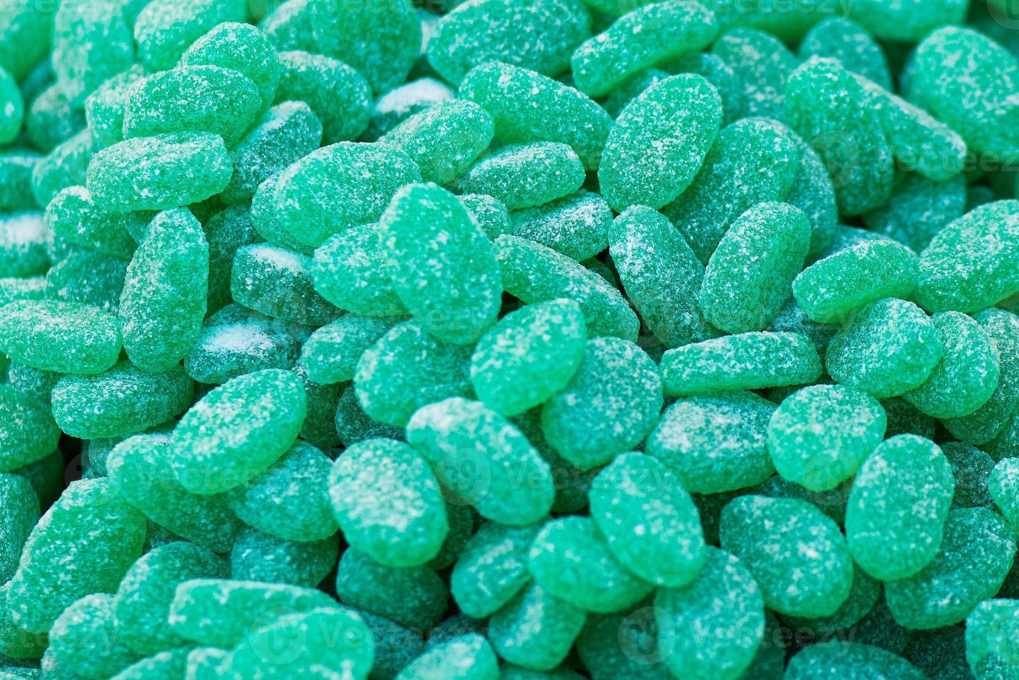 Green jelly mint candies sprinkled with sugar photo