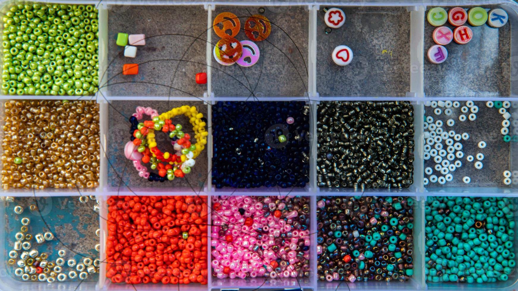 A creative set of various beautiful sewing handmade materials .beads weaving. photo