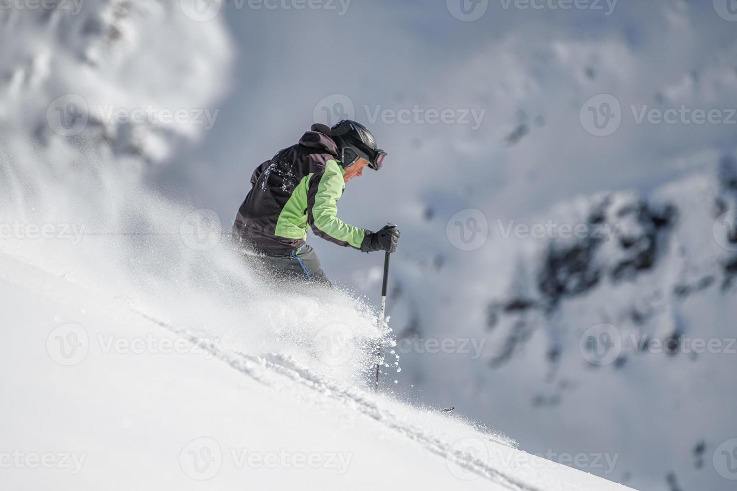 Off-piste skier alone photo